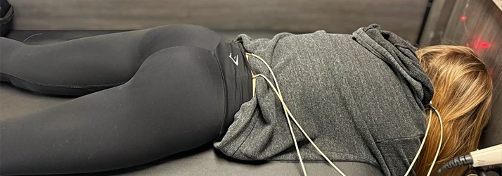 Woman Lying Face Down Receiving Therapy on Her Back Therapy Services